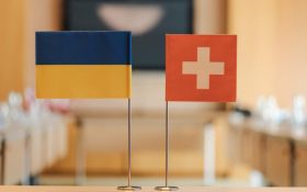 Flags of Switzerland and Ukraine. Photo for illustration